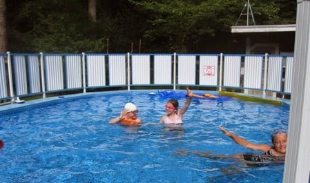 Children in an above ground pool